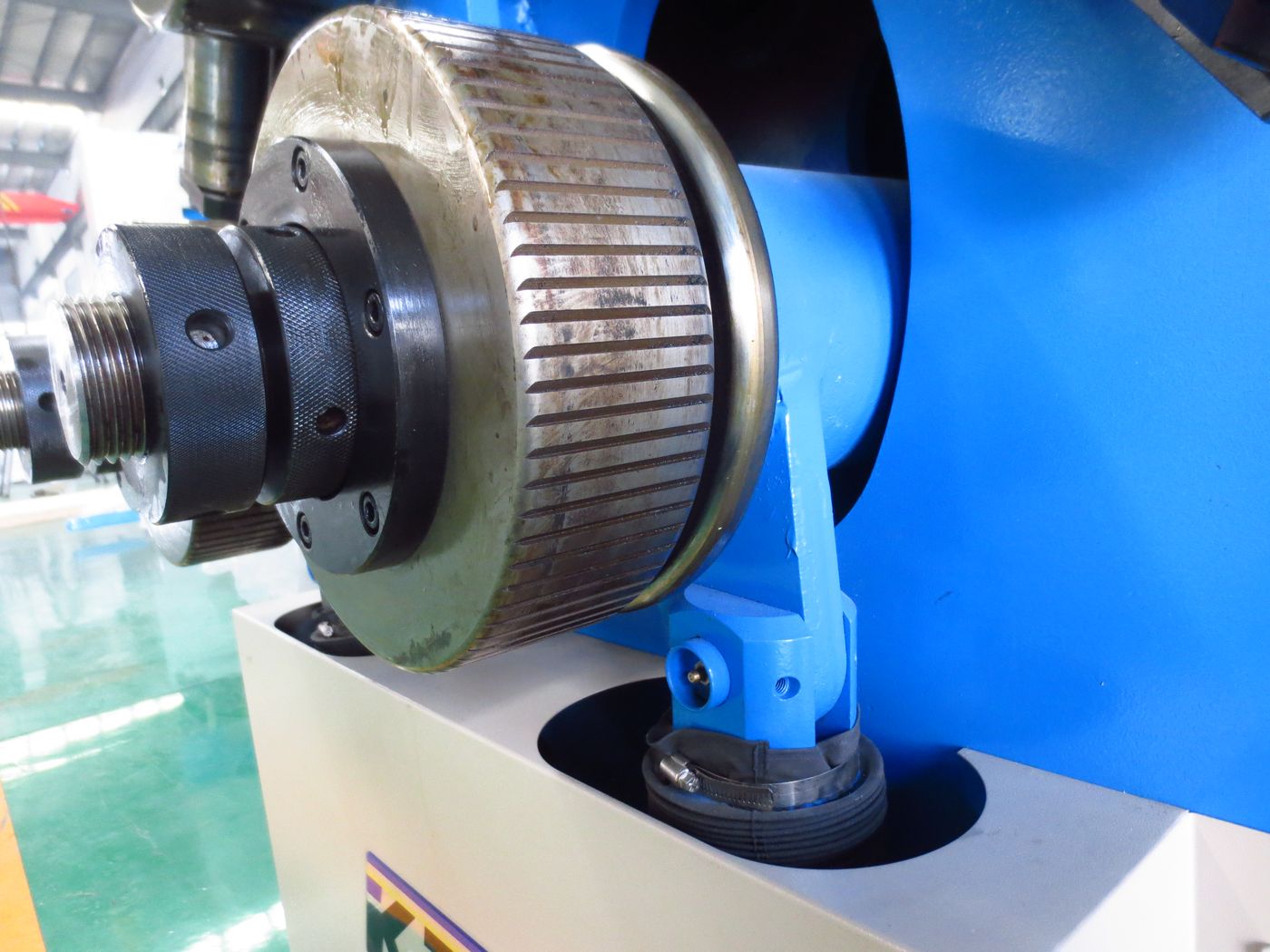 Close-up of roll bender rollers and hydraulic cylinders
