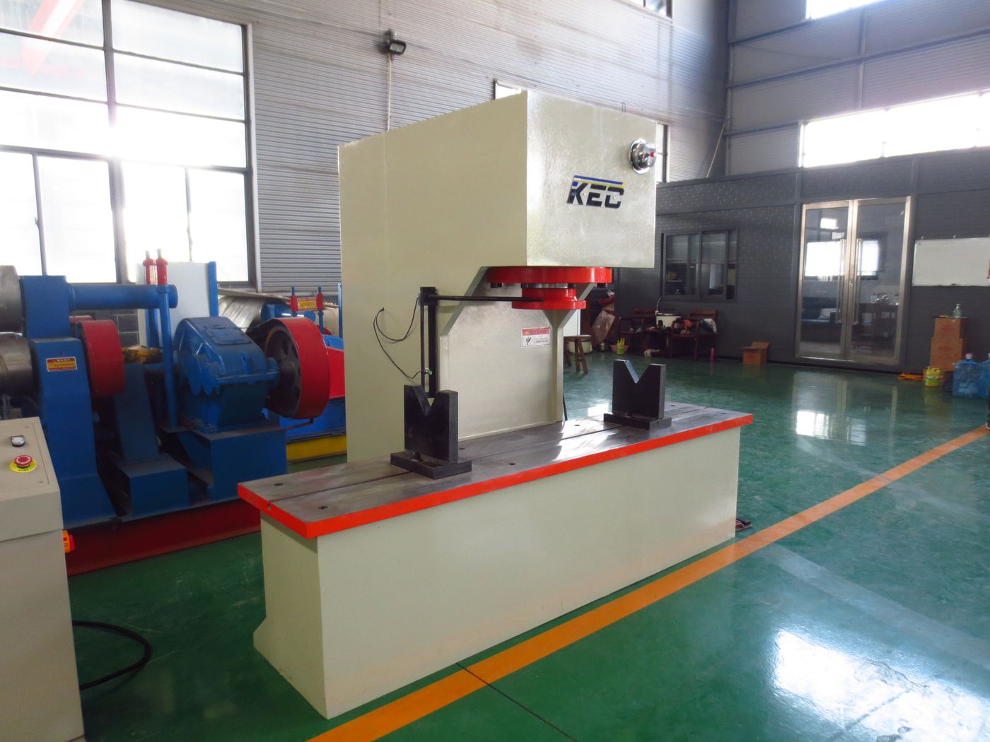 KEC C-frame hydraulic press machine in the workshop with roller bender alongside