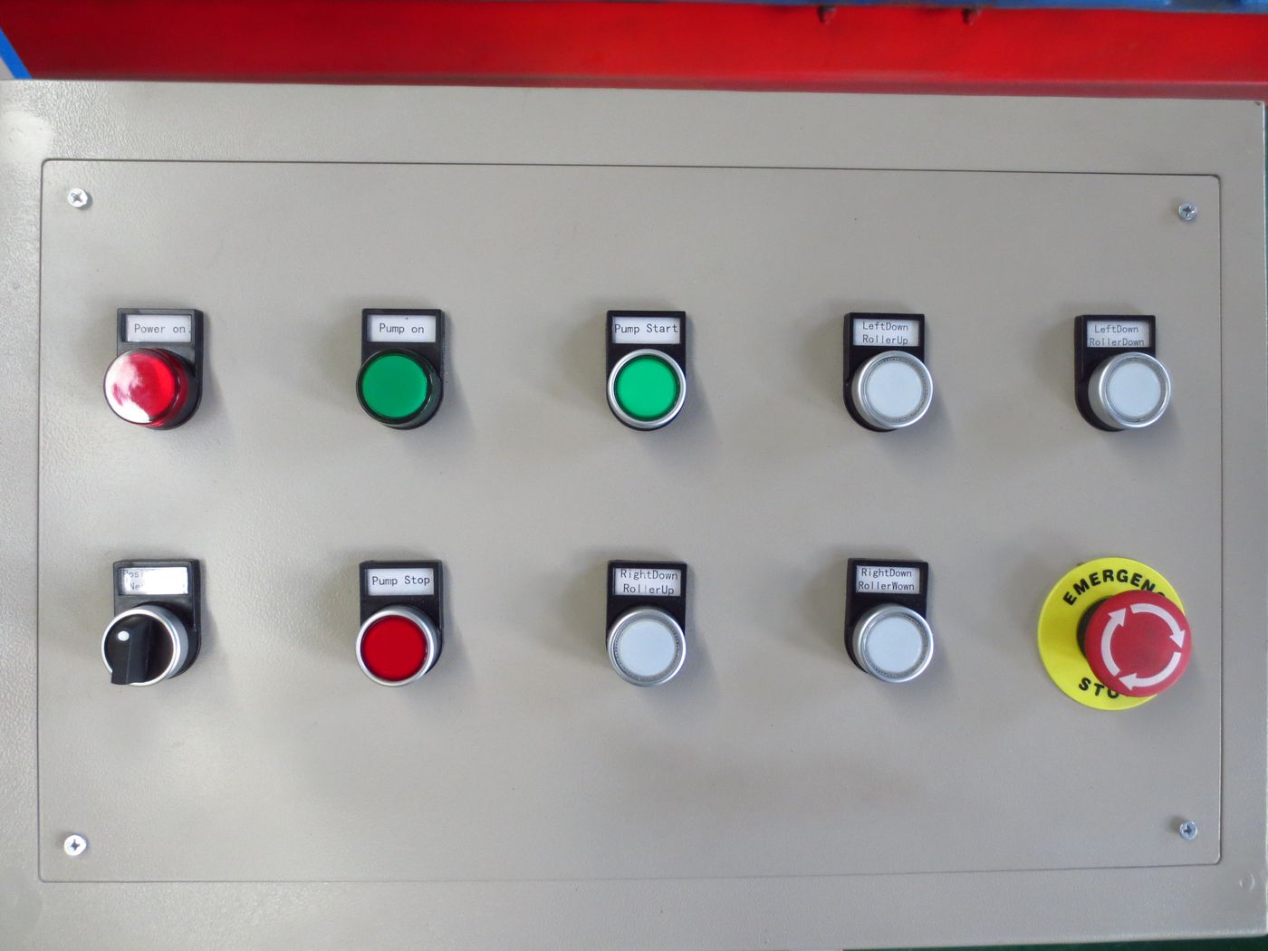 Roll bender control panel with power, pump and roller buttons and emergency stop